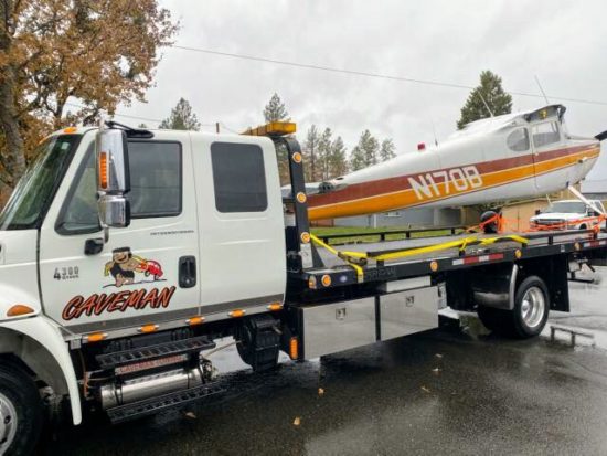 Caveman Towing Airplane